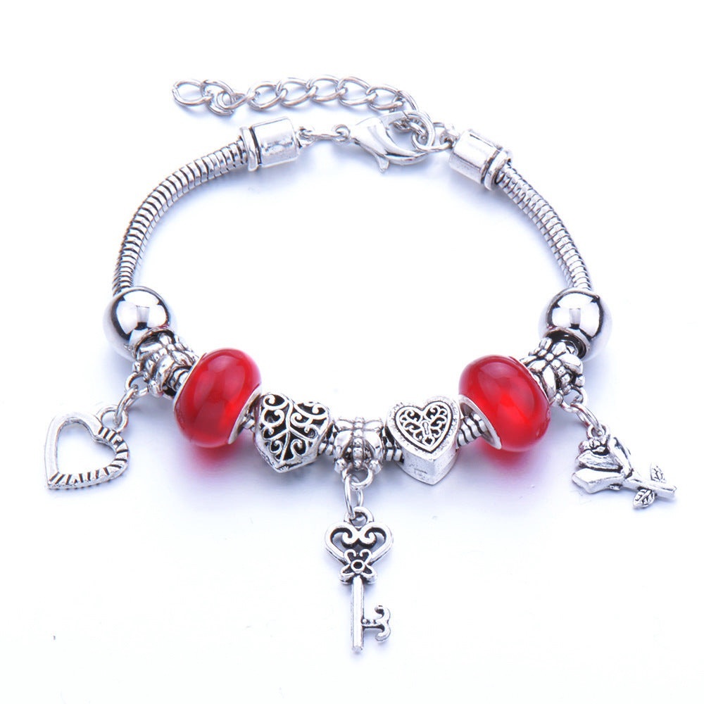 Silver Charm Bracelet with Red Beads